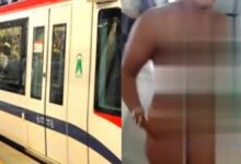 Photo of Mujer se quita la ropa en el Metro de Santo Domingo